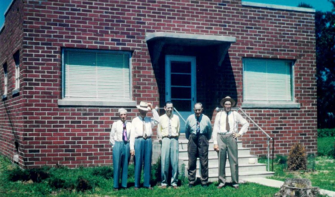 Second Pilot Grove Savings Bank building. Photographed are Frank Overton, Joe Nichting, Joe Steffensmeier (cashier), Theodore Schinstock, and B.J. Holtkamp.