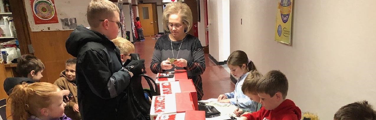 Students from Winfield elementary school are able to make weekly contributions to their School Bank savings account.