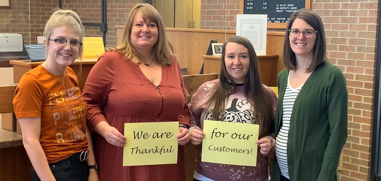 Employees for Pilot Grove Savings Bank saying, "we are thankful for our customers."