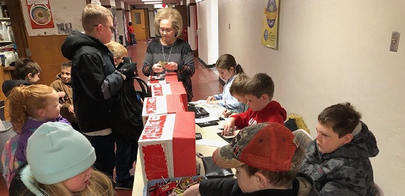 Students from Winfield elementary school are able to make weekly contributions to their School Bank savings account.
