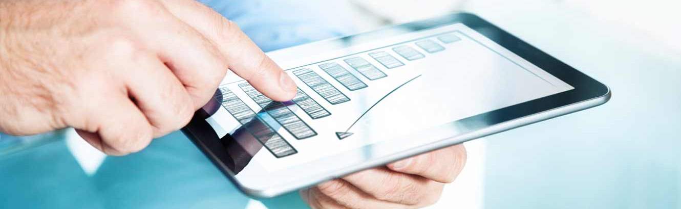 Person pointing to a chart which shows growth
